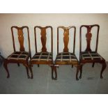 A SET OF FOUR ANTIQUE DINING CHAIRS WITH CABRIOLE LEGS