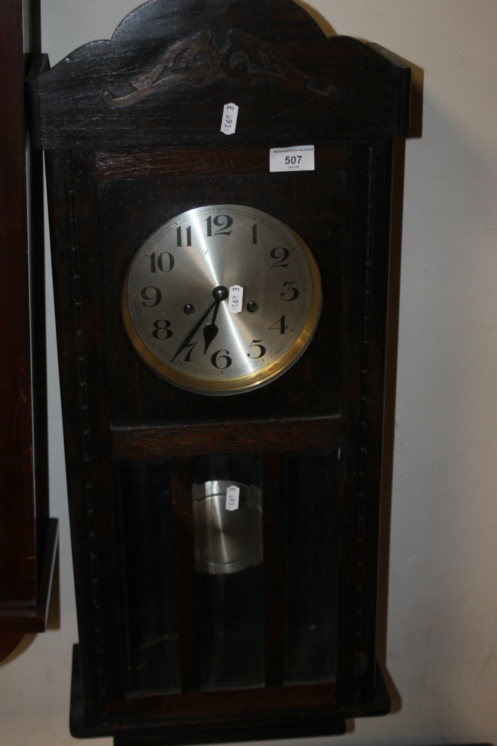 AN OAK HANGING WALL CLOCK