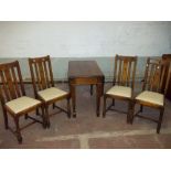 A DROP LEAF WOODEN TABLE AND FOUR CHAIRS 1930S/40S