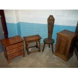 AN OAK LINENFOLD BEDSIDE CUPBOARD, AN OAK STOOL, A THREE DRAWER CHEST AND A HALL CHAIR (4)