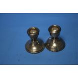 A PAIR OF HALLMARKED SILVER DWARF CANDLESTICKS