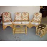 A FIVE PIECE BAMBOO CONSERVATORY SUITE COMPRISING A TWO SEATER SOFA, TWO CHAIRS, A COFFEE TABLE