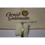 A 9 CT GOLD LADIES ACCURIST WRIST WATCH