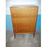 A TEAK RETRO FIVE DRAWER CHEST ON LEGS