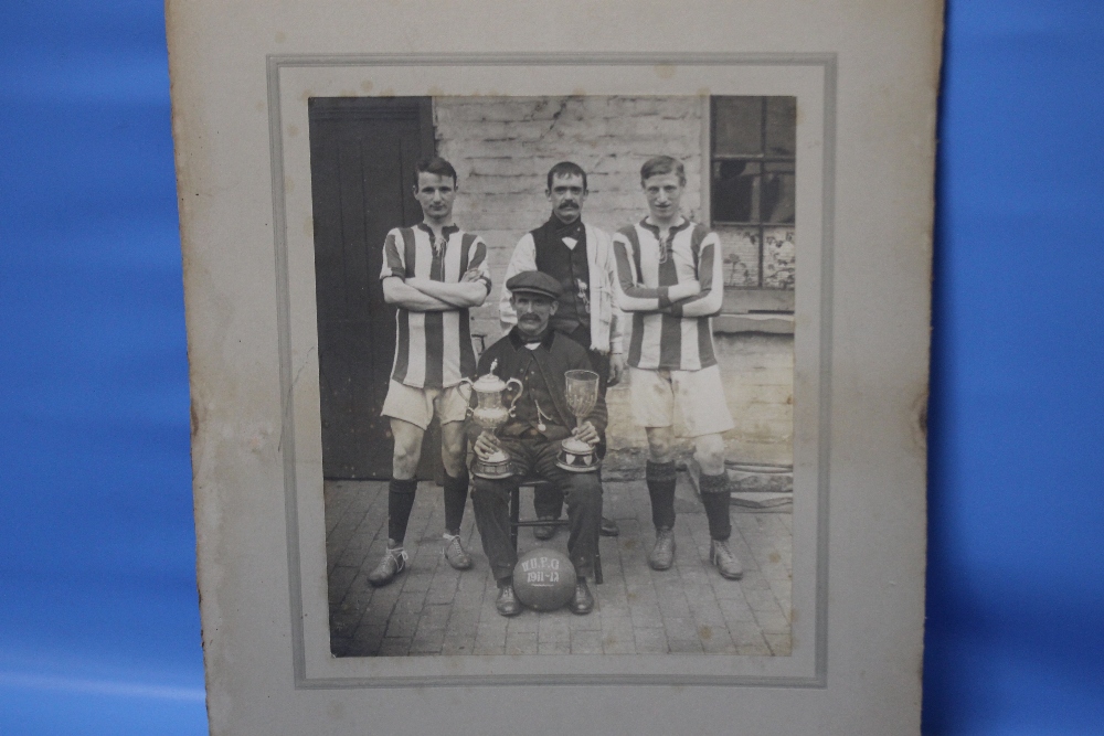 W.U.F.C. 1911-12, a photograph of four men with two trophies and a football, two in sports strip and - Image 2 of 2