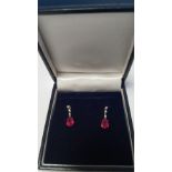 A PAIR OF 18 CT WHITE GOLD RUBY AND DIAMOND DROP EARRINGS WITH BUTTERFLY BACKS, RUBIES ARE 2.00