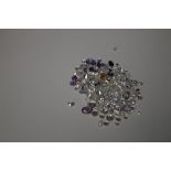 A BAG OF LOOSE MIXED STONES INCLUDING CUBIC ZIRCONIA, RUBY, SAPPHIRE, AMETHYST AND CITRINE, 93.8 CT