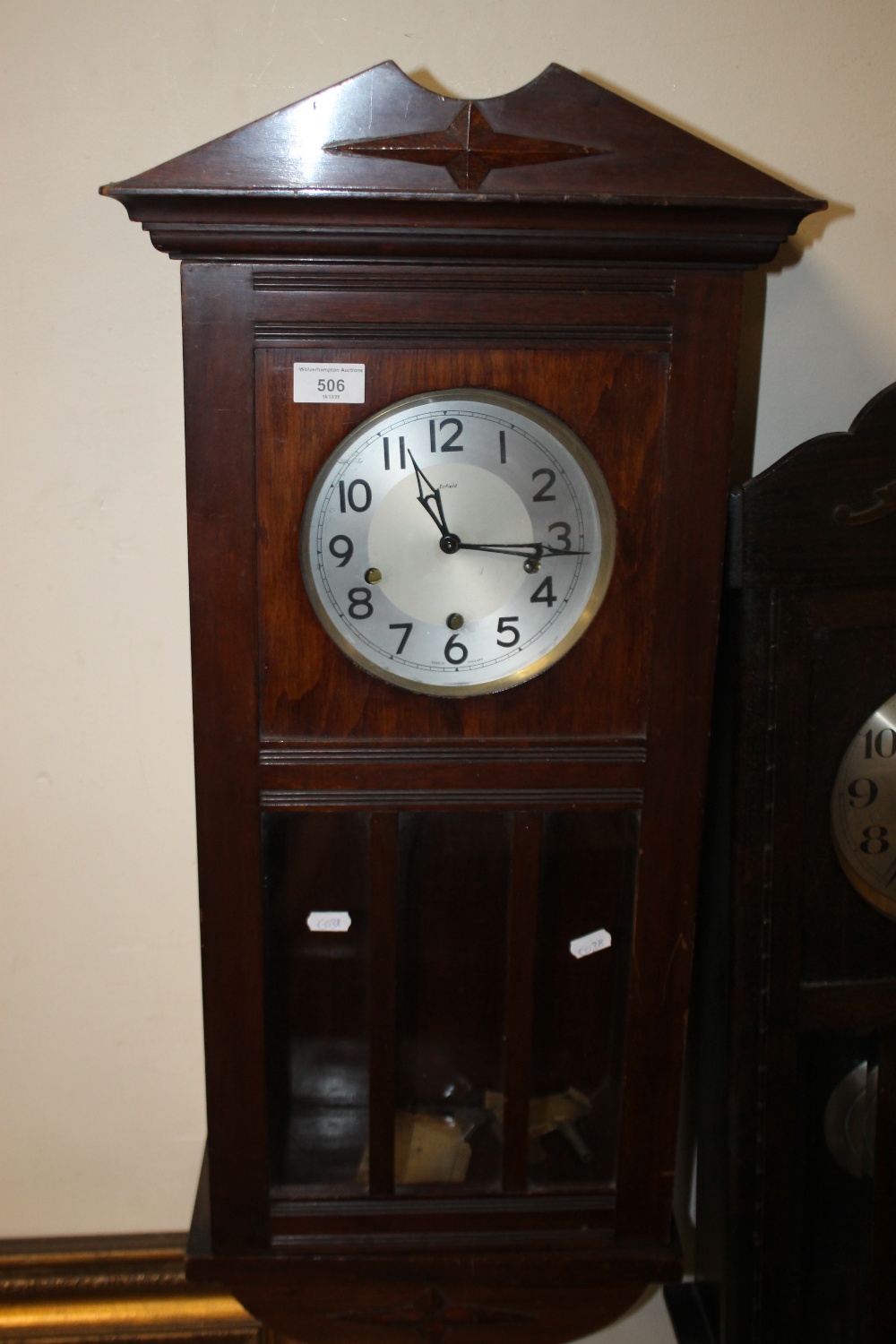 AN ENFIELD HANGING WALL CLOCK