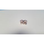 A PAIR OF MORGANITE SILVER STUDS