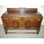 AN ANTIQUE OAK SIDEBOARD