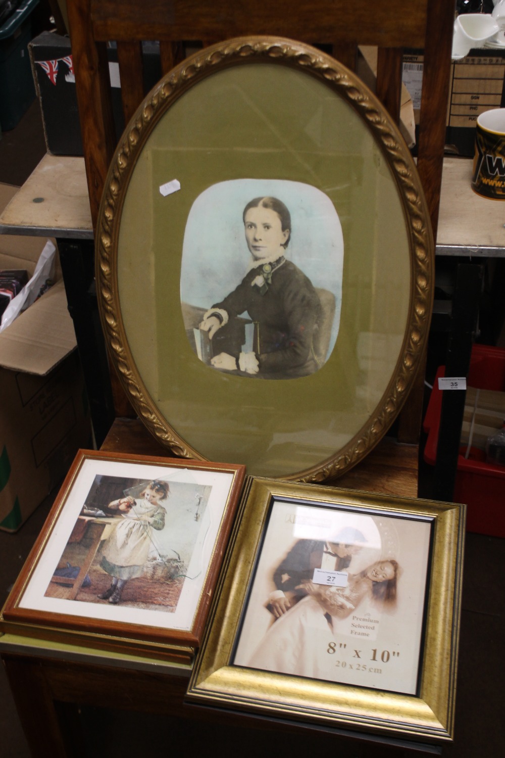 AN OVAL FRAMED PORTRAIT TOGETHER WITH A COLLECTION OF PRINTS