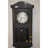 AN OAK CASED WALL CLOCK A/F