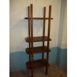 A HEAVY MAHOGANY SHELF UNIT