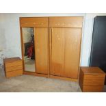 A MODERN FOUR PIECE BEDROOM SUITE CONSISTING OF TWO WARDROBES AND TWO CHESTS OF DRAWERS