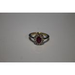 18 CT YELLOW GOLD OVAL CUT RUBY AND RBC DIAMOND CLUSTER RING, RUBY 0.80 CT, DIAMONDS 0.40 CT