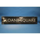 A FRAMED "SLOANE SQUARE" SIGN