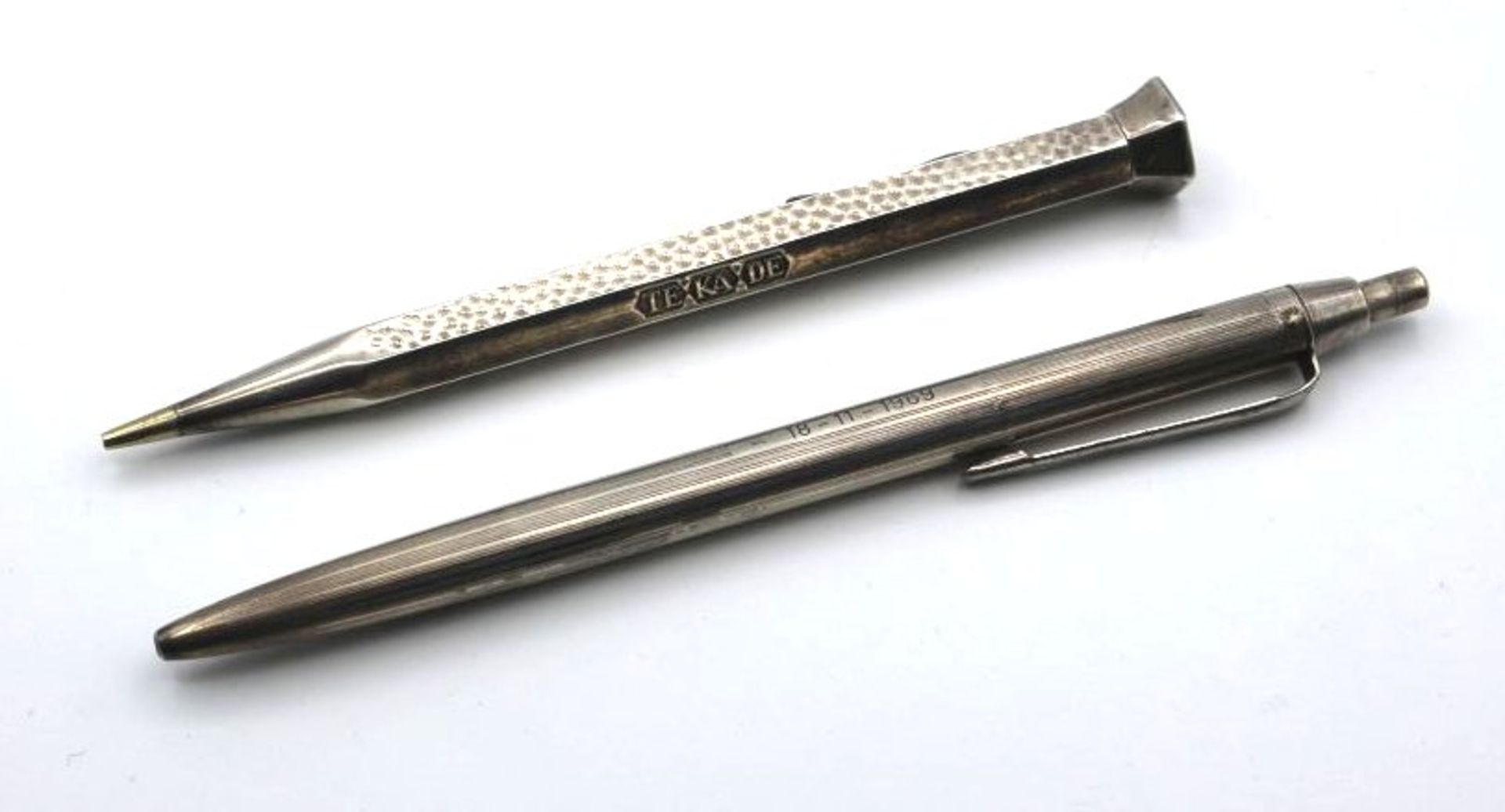 Kugelschreiber und Bleistifthalter, je 835er Silber, zus. ca. 29gr., L-ca. 13,5cm.