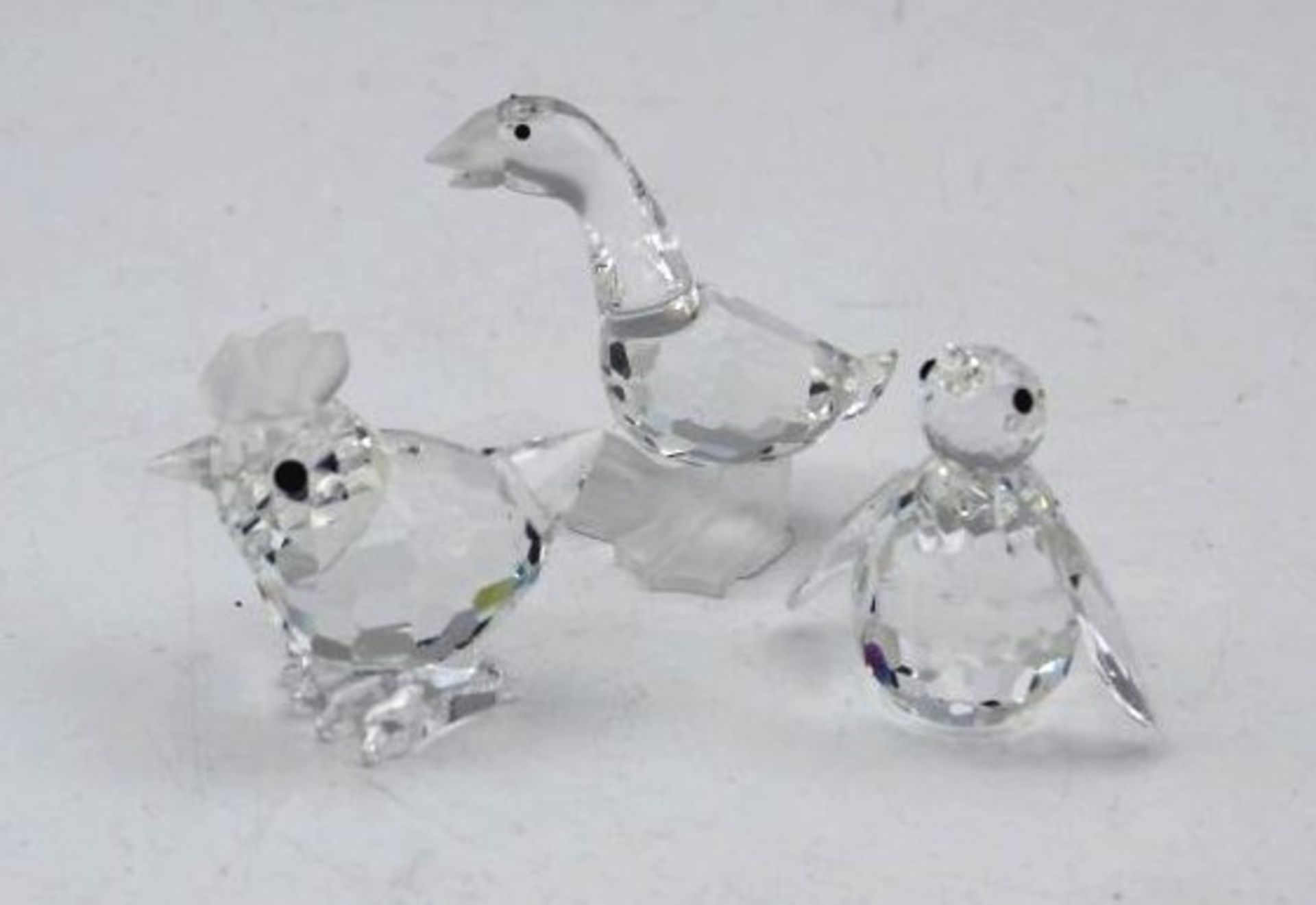 3x div. Swarovski-Tiere, Henne, Pinguin und Gans , ca. H-4,5cm.