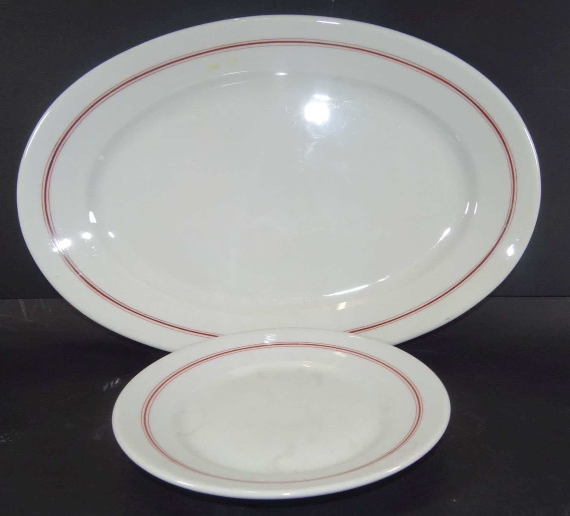 ovale Platte und kl. Teller, Marinegschirr, KPM, dat. 1940/42, roter Rand, 40x25 cm und D-20 cm