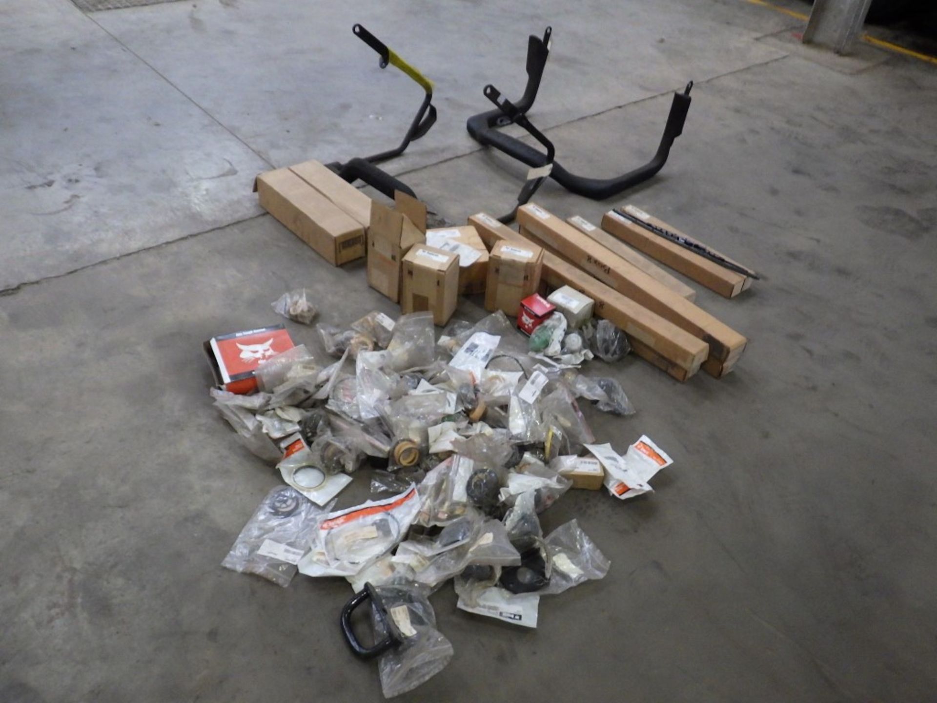 ASSORTED BOBCAT PARTS INCL. SAFETY FRAME / BARS, SEAT BELT, GAS STRUTS, HANDLES, LATCHES, NUTS,