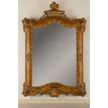 Shaped line mirror in gilded and lacquered wood