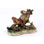 Polychrome porcelain sculpture depicting a farmer