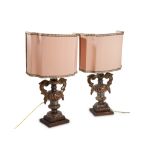 Pair of lamps in carved and silvered wood manifacture toscana, early 19th century, in the shape of
