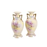 Pair of polychrome porcelain vases France, Liberty, decorated on the front with flowers, golden