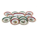 Lot of 12 plates and a porcelain trayfirst half 20th century, decorated with birds, gold finishes