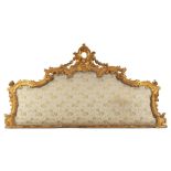 Headboard in carved and gilded wood 19th century, decorations carved with scrolls, vegetable and