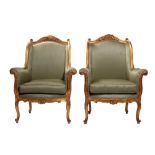 Pair of bergère France, '30, in carved and gilded wood, padded and covered in green fabric, arched