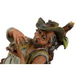 Polychrome porcelain sculpture depicting a farmer mid 20th century, marked N crowned23 x 28 cm