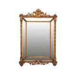 Gilt and carved wooden mirrorToscana early 20th century, rectangular frame decorated with plant