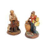 Pair of terracotta sculptures depicting merchants Italy, 20th century, painted and signedh 14 and 13