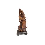 Soapstone sculpture Cina, 20th century, depicting wiseman with animal, on wooden base, small