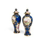 Pair of jars with lidInghilterra, early 20th century, in polychrome porcelain, with peacock