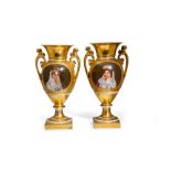 Pair of vases France, 20th century, in gilded porcelain, on the back portraits of noblewomen
