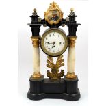 Temple clock in ebonized wood with alabaster columnsVienna, mid 19th century, circular dial with