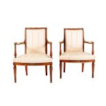 Pair of armchairs manifacture toscana, early 19th century, in carved and partially gilded cherry