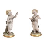 Pair of sculptures of putti players Italian manufacture, mid 20th centuryin polychrome ceramic,