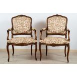 Pair of Louis XV style walnut armchairsLiberty periodclad in floral pattern fabric102 x 63 cm