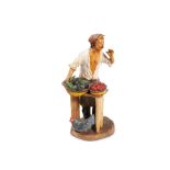 Terracotta sculpture of a seller, CaltagironeSicily, mid-twentieth centurysigned R. Romano h 25 cm