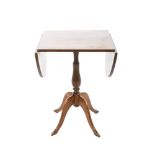 TableItaly, mid-20th centurymahogany wood, oval top, baluster support on four feet, slight signs