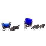 Pair of miniature silver salt shakerslike chariots, with blue glass bowls, gross weight gr 144 about