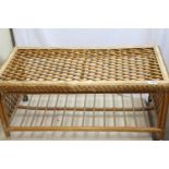 Modern rattan conservatory low table with shelf under, missing one castor, 50 (ht) x 112 x 55cm