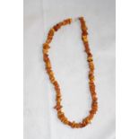 A necklace, likely made of amber