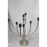 A lot: a mid-century modern 9-branched articulated stainless steel candelabra plus nine cream