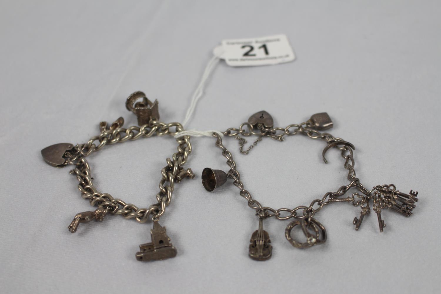 Pair of silver charm bracelets 57.2g