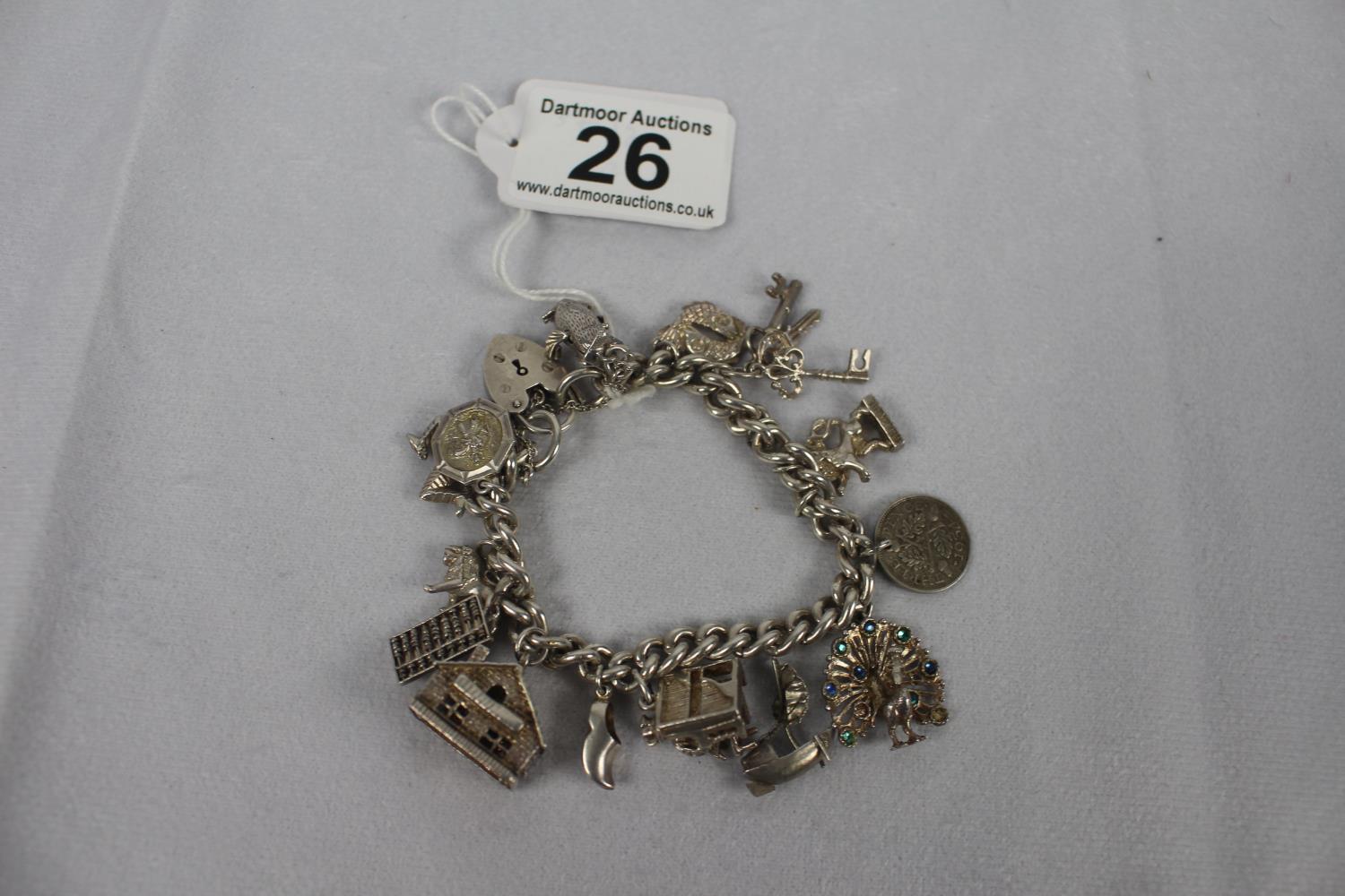 Heavy silver charm bracelet 57.3g