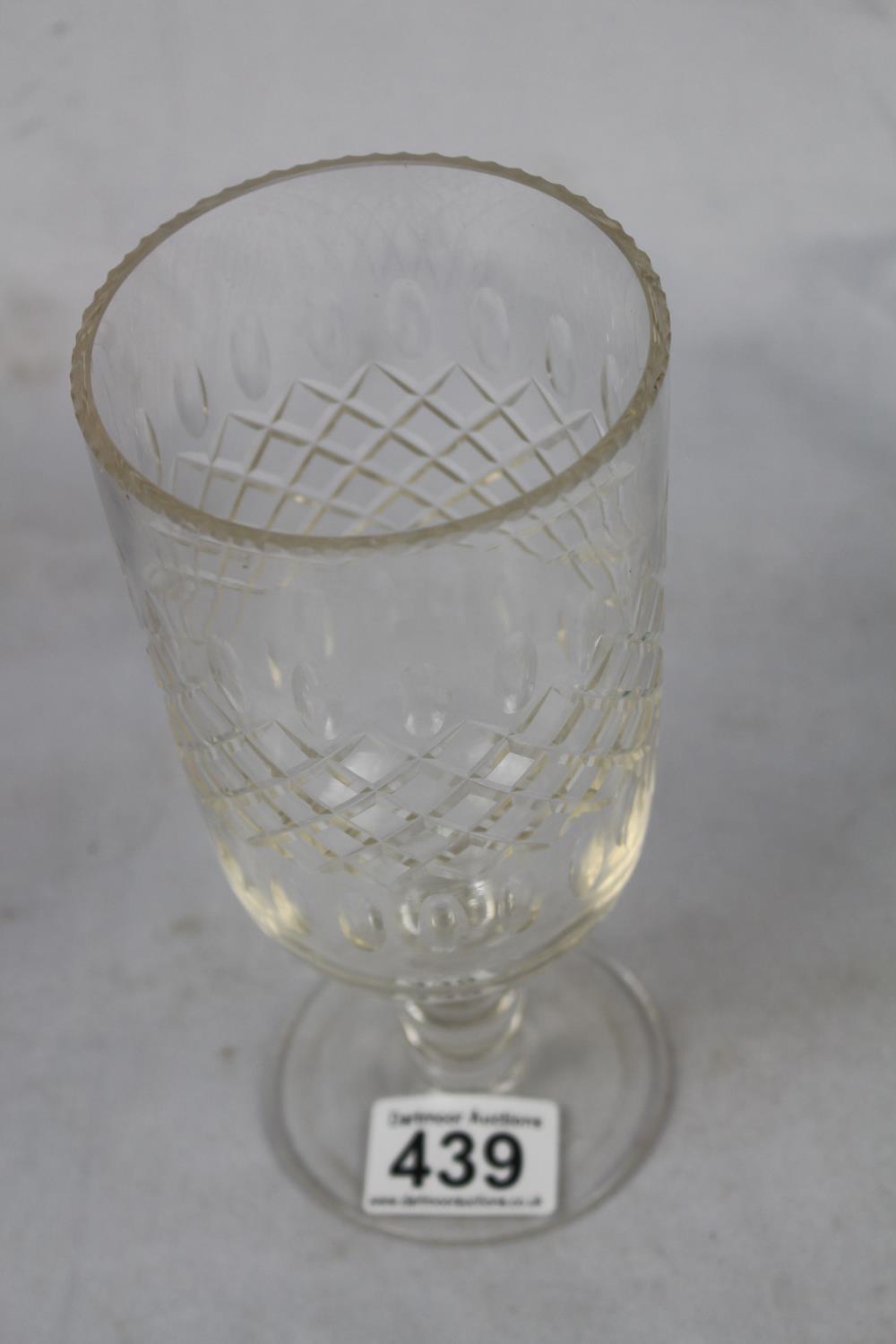 A lead crystal vase with fluted rim